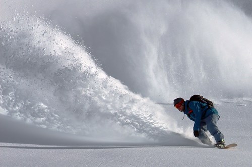 Skiing-in-powder-book-early