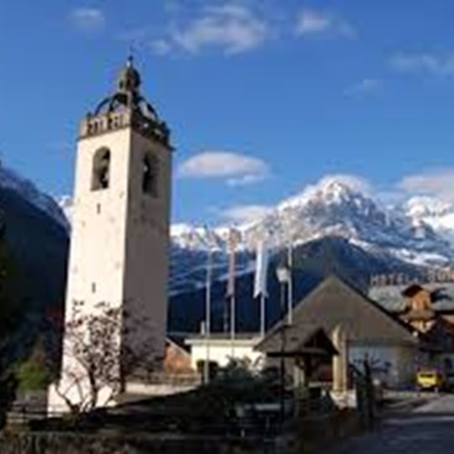 Sunny street view of the Hotel Suisse and village