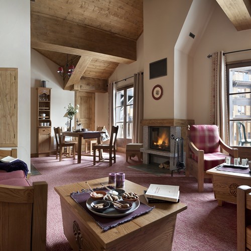 Ski in, ski out Le Village Arc 1950 ski apartments lounge with fireplace