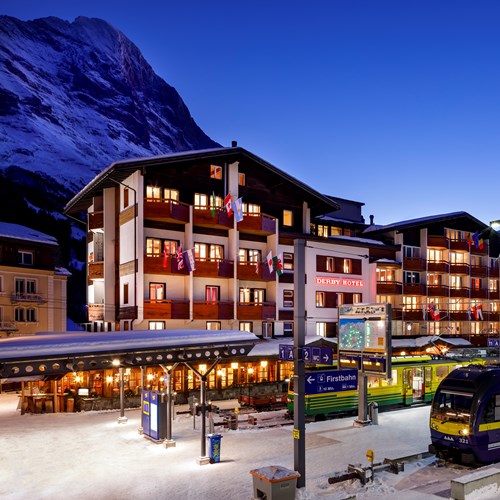 hotel exterior at night with train Hotel Derby Grindelwald
