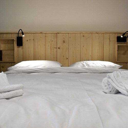 The People Hostel bedroom bed.jpg