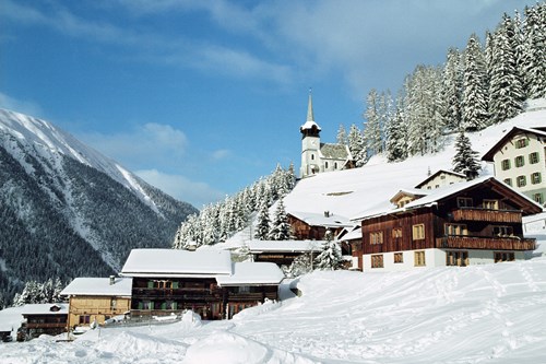 Snow covered klosters village with blue sky
