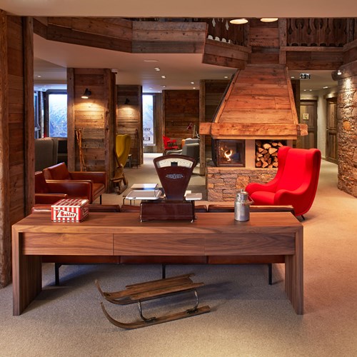 ski in ski out hotel Trois Vallees in Courchevel-open fire and lounge area