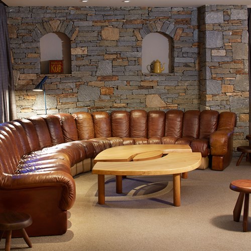 ski in ski out hotel Trois Vallees in Courchevel-leather corner sofa