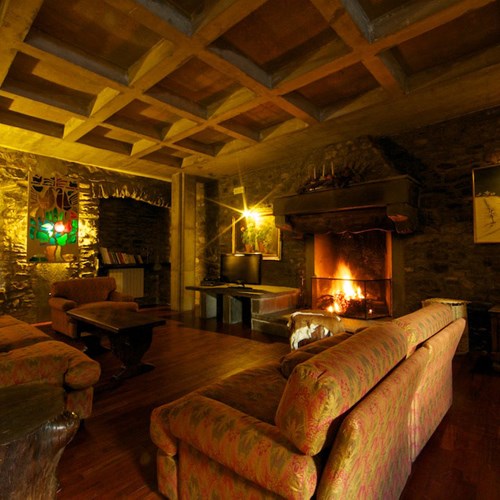 roaring fire in the living room of Hotel Dolonne Courmayaur