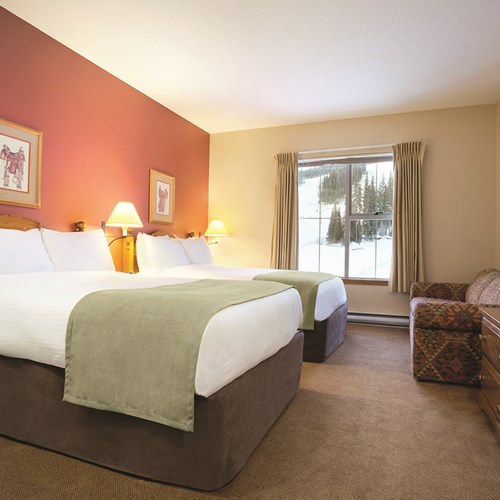 Family room with 2 double beds at Coast Sundance Ski Lodge, Sun Peaks
