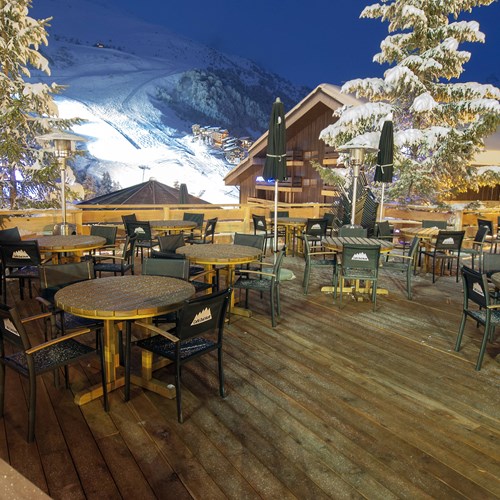 terrace at night at Hotel Le Mottaret, ski hotel in Meribel ski resort