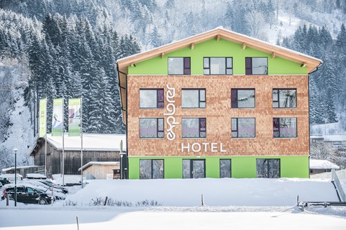 Explorer Hotel, Ski Hotel in St Johann, Austria, exterior in snow
