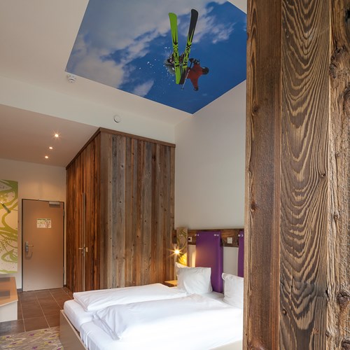 Twin room at Explorer Hotel, ski accommodation in St Johann, Austria