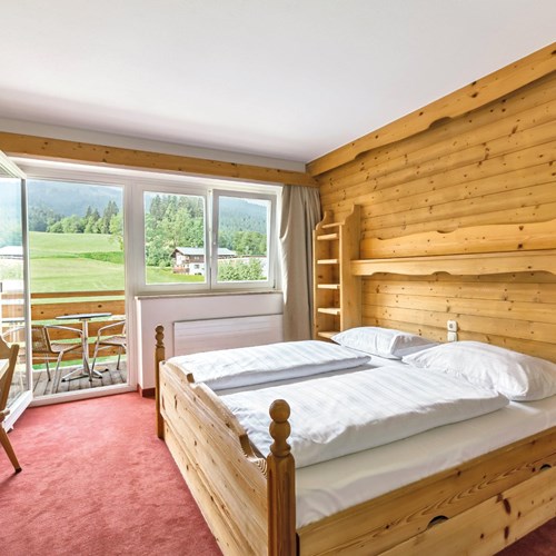 Lti Alpenhotel Kaiserfels, ski accommodation in Austria, double bedroom