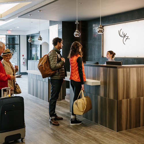 Elk + Avenue Hotel, contemporary ski hotel in Banff - check in at reception