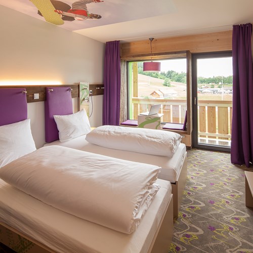 Twin room at Explorer Hotel, ski accommodation in St Johann, Austria