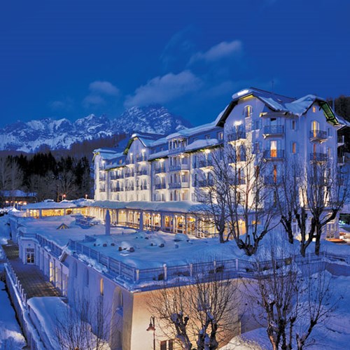 snowy exterior of the Hotel Cristallo in Cortina, Italy
