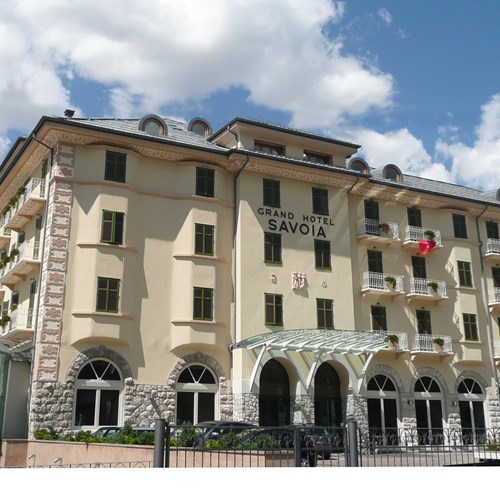 Grand Hotel Savoia Cortina exterior in blue skies