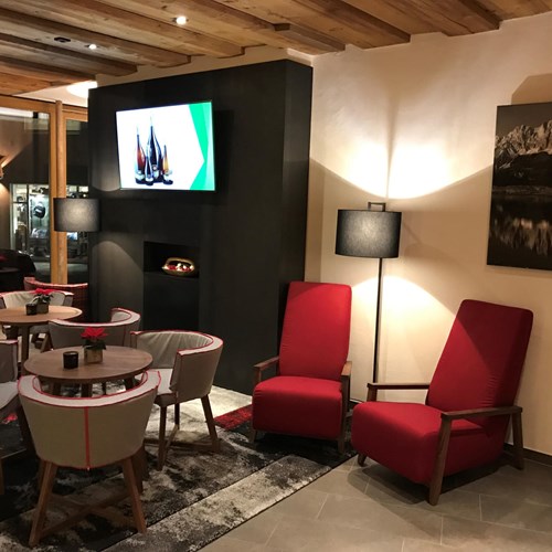 Fire in lounge at Hotel Fischer, ski accommodation in St Johann, Austria