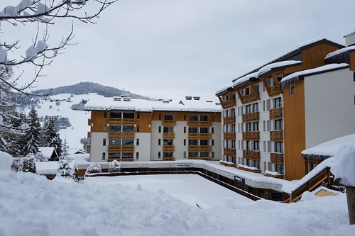Royal Rochebrune Hotel, Ski Accommodation in Megeve, France - exterior in snow